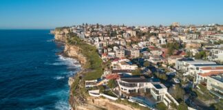 Aerial view of residential area across rock cliff area in Sydney coastline